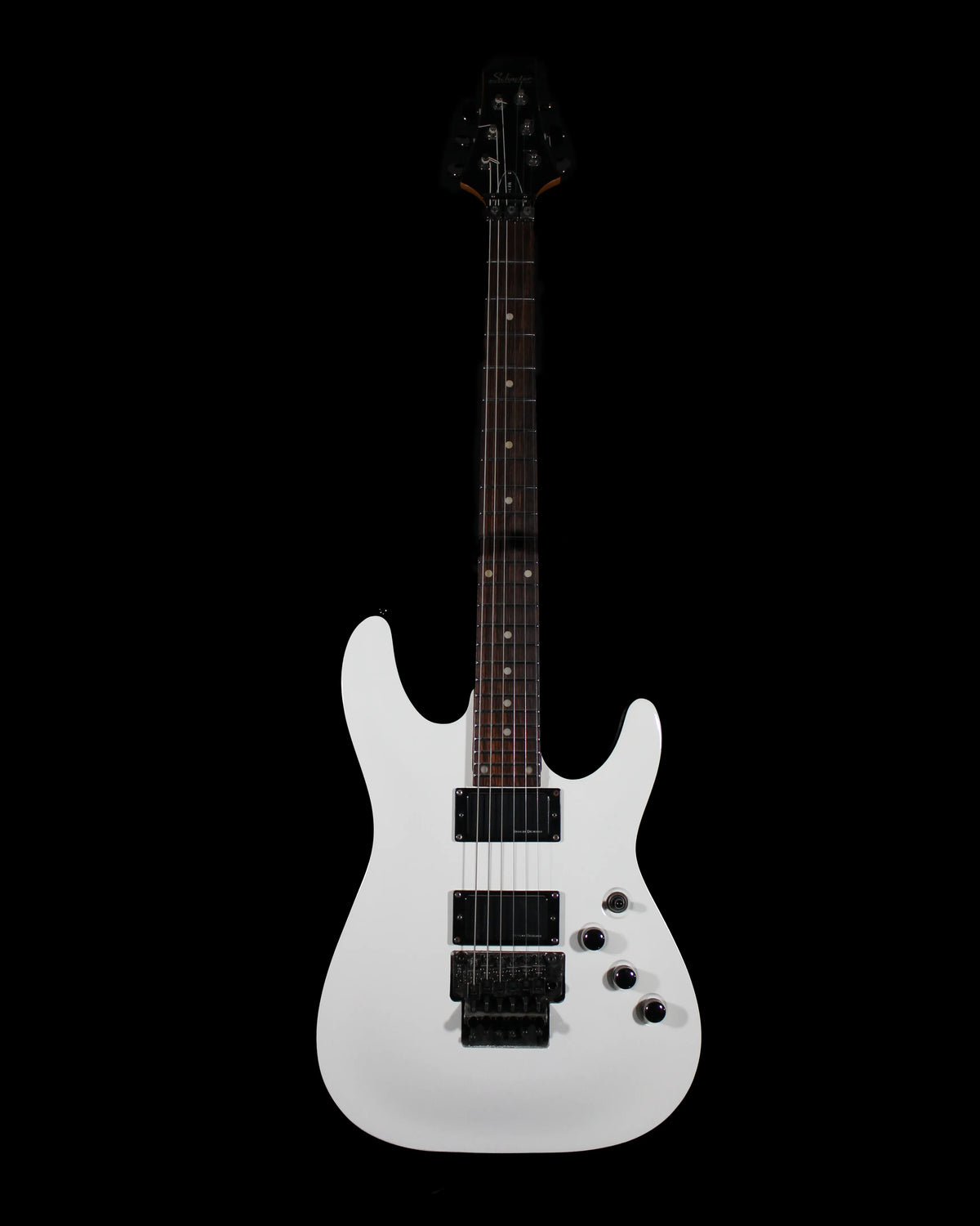 Electric guitar Schecter C1 FR by CDS Guitars with a sleek black finish and modern design, shown on a stand.
