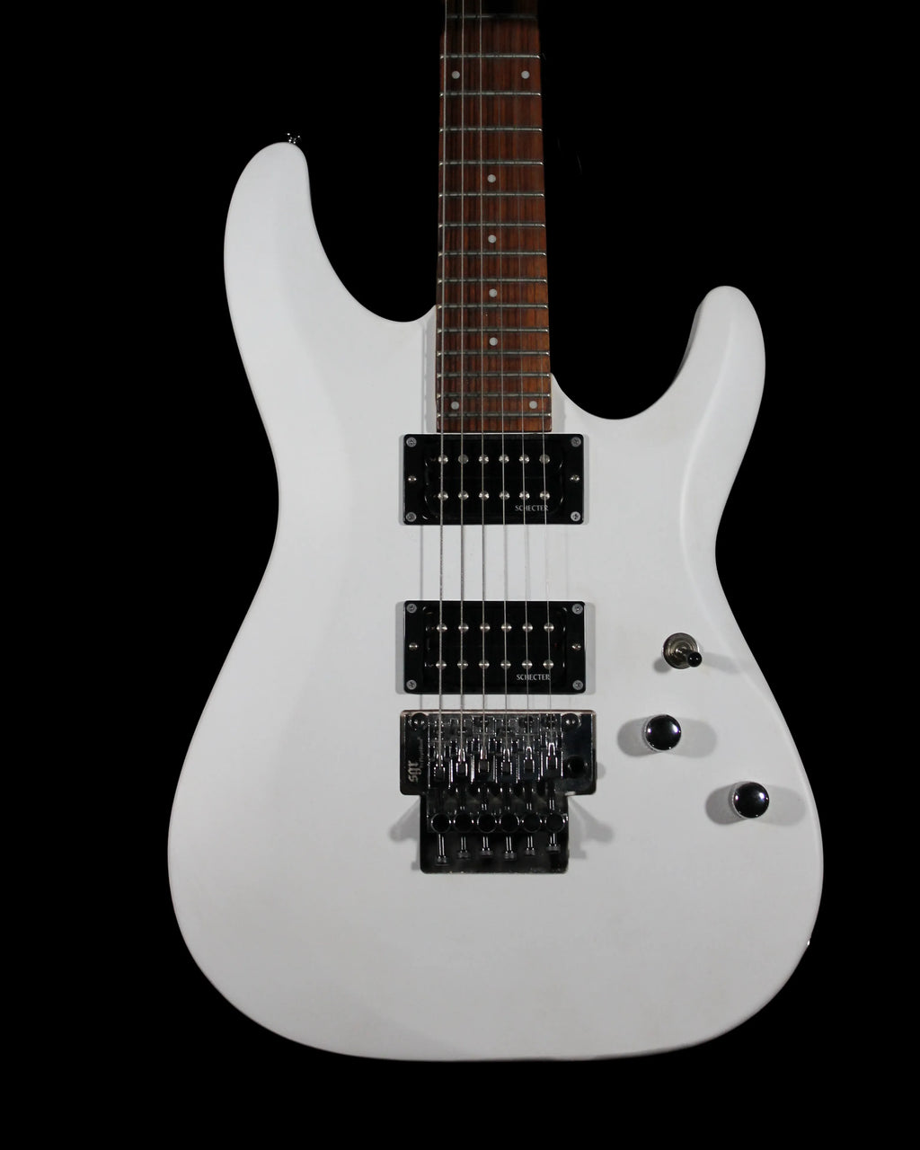 CDS Guitars Schecter C6 FR Deluxe electric guitar with sleek black finish and floating tremolo bridge, close-up of body and pickups.