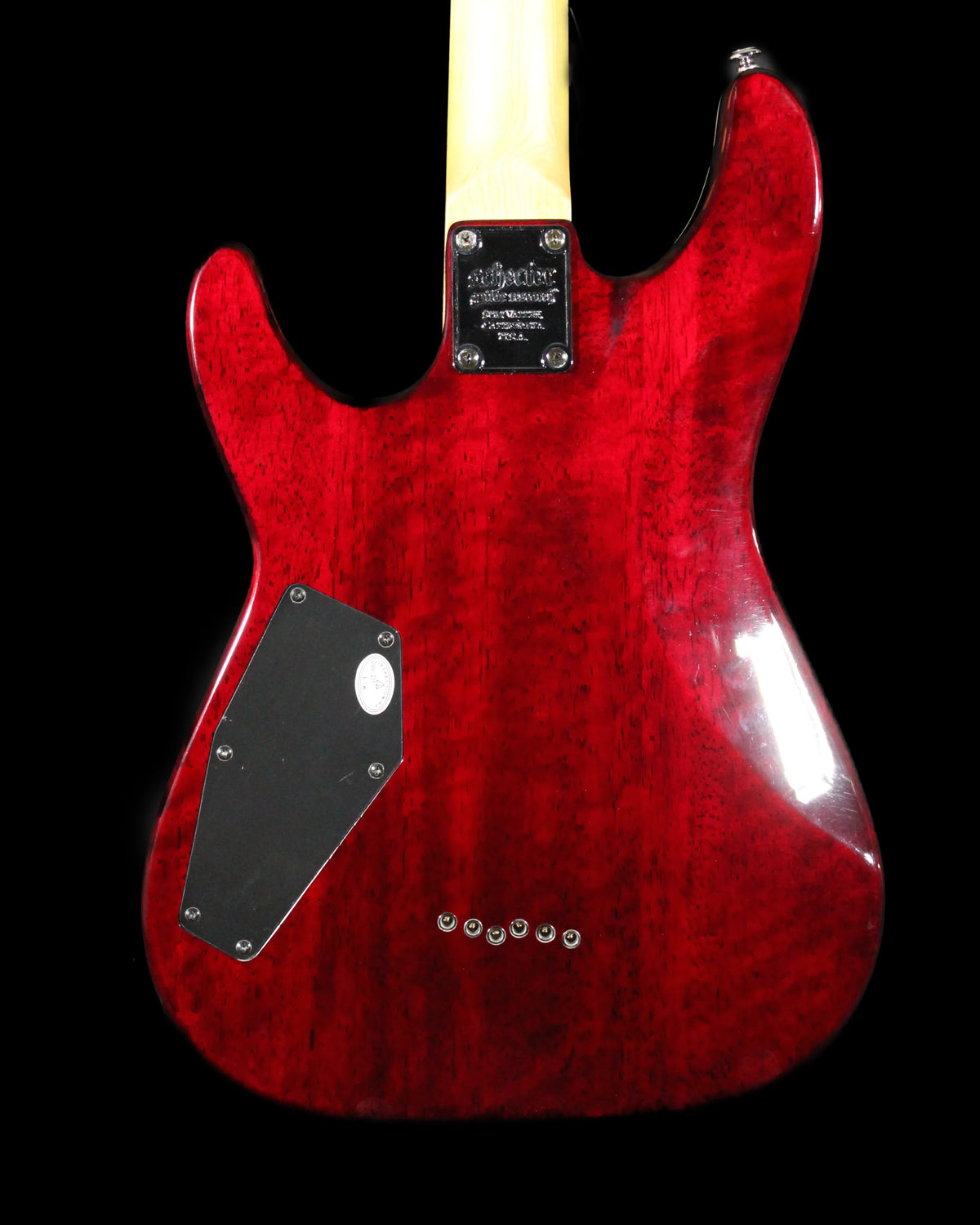 Schecter Omen Extreme electric guitar with black finish, featuring a sleek body, six strings, and modern hardware.