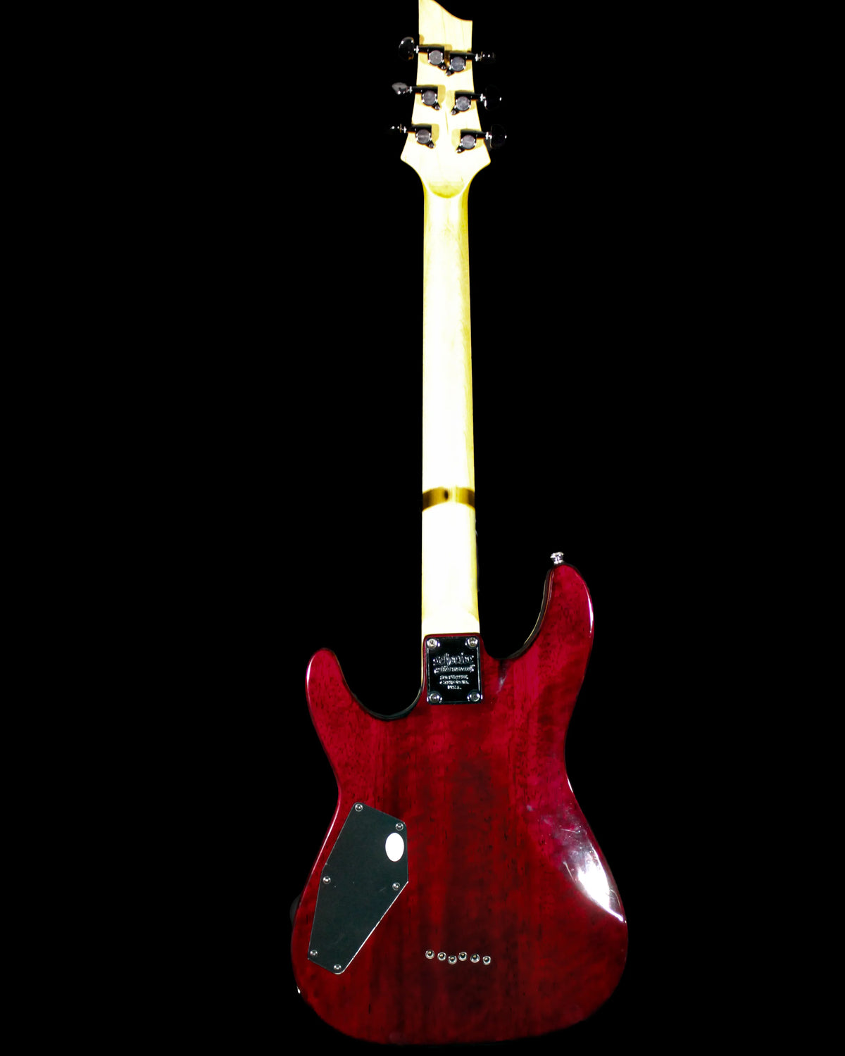 Schecter Omen Extreme electric guitar with sleek black finish and modern design, featuring dual humbucker pickups and a tremolo bridge.