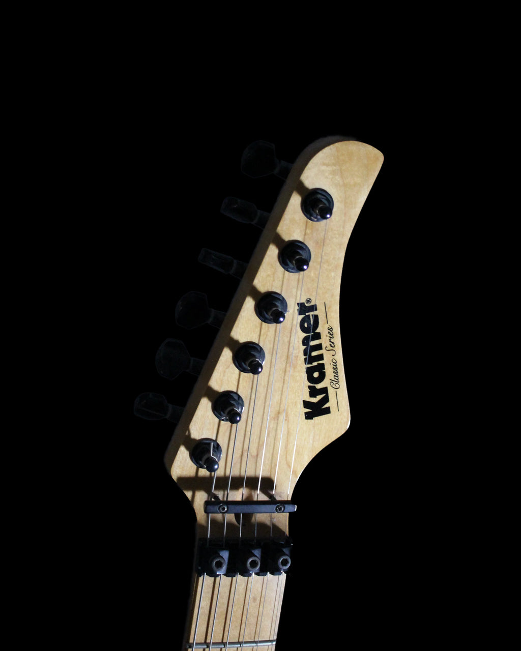 Kramer Pacer Classic Series electric guitar with black finish and chrome hardware, positioned upright against a plain background.
