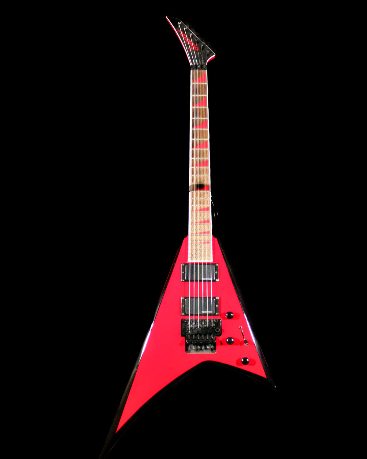 Jackson RRX24 Rhoads electric guitar by CDS Guitars with a sleek black finish and sharp V-shaped body, shown from a front angle.