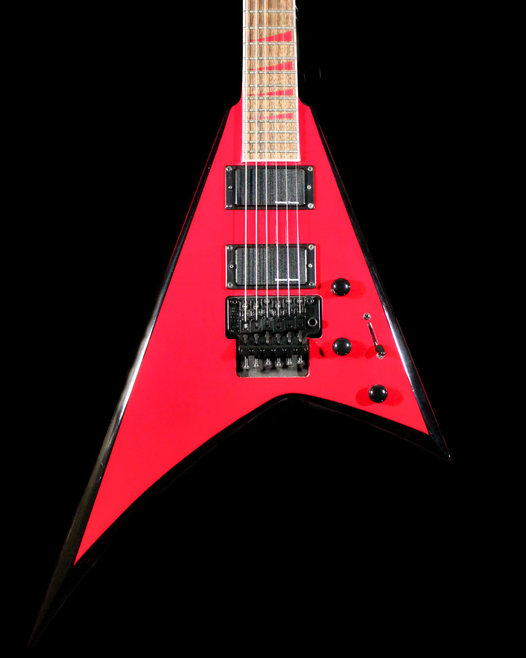 Jackson RRX24 Rhoads electric guitar by CDS Guitars with black finish, pointed body, and dual humbucker pickups.