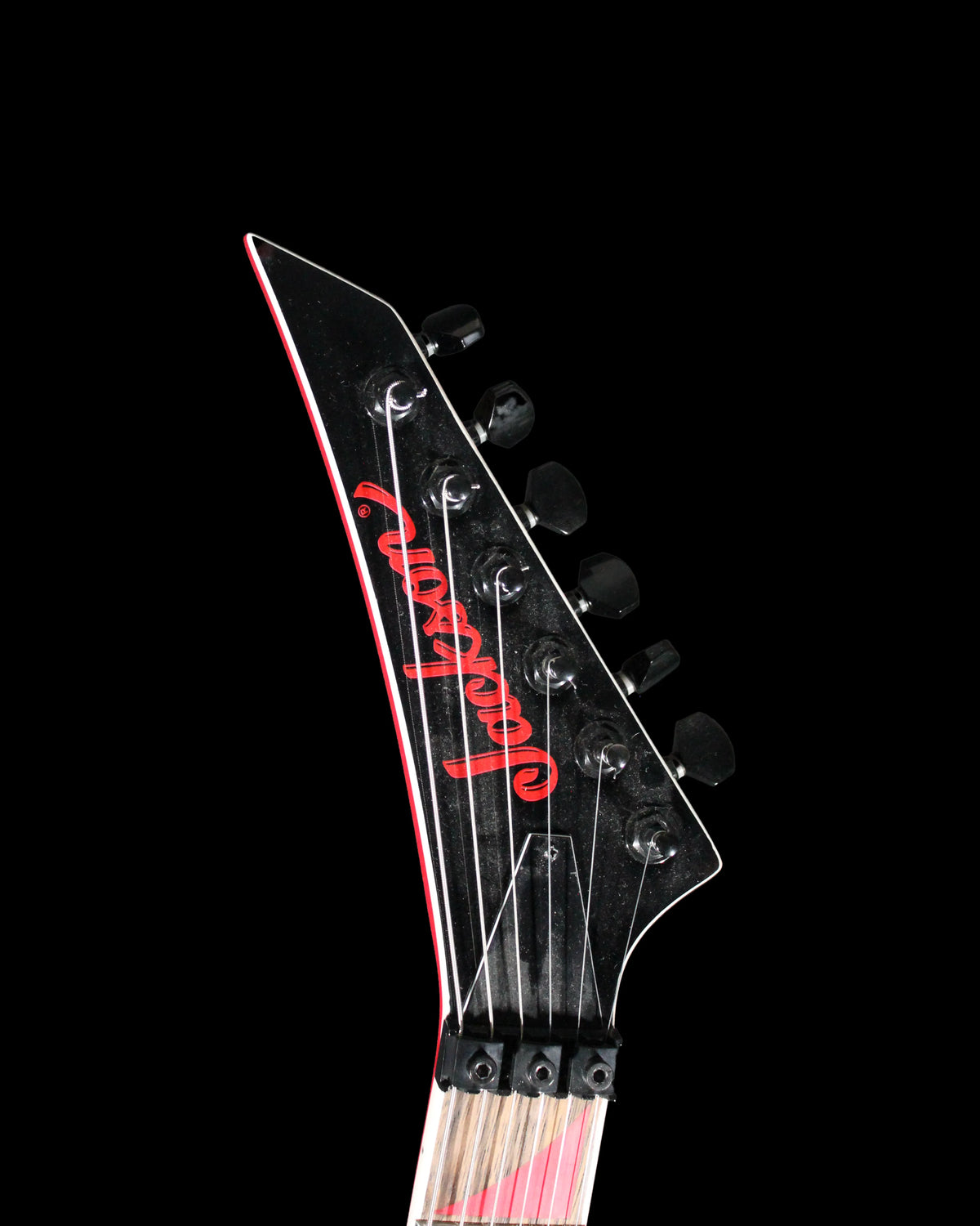 Jackson RRX24 Rhoads electric guitar by CDS Guitars, sleek black finish with sharp winged body and six-string layout.
