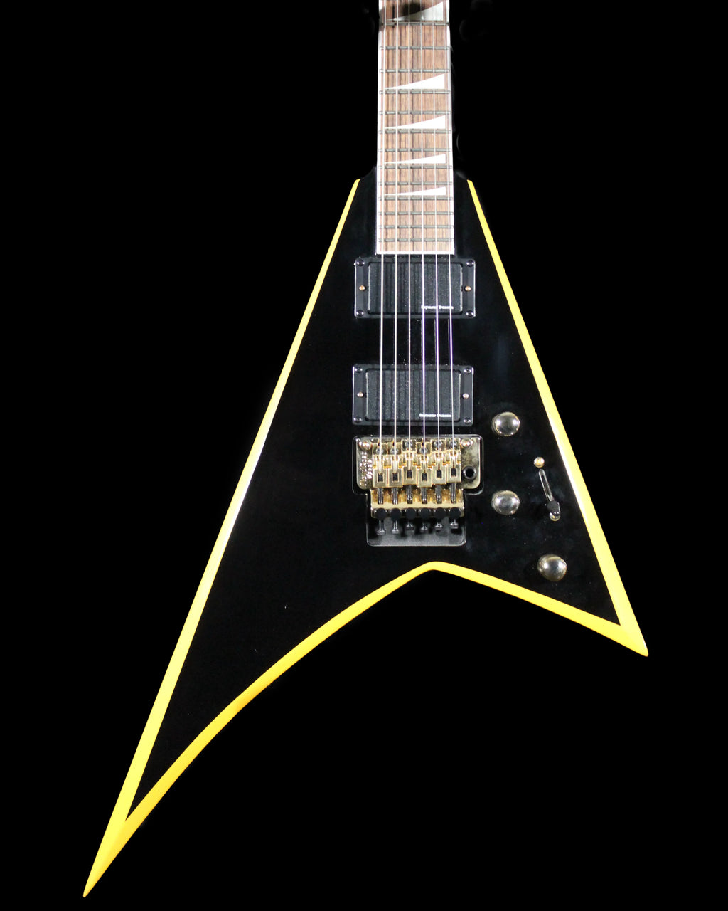 Jackson RRX24 Rhoads electric guitar by CDS Guitars, black finish with sharp V-shaped body and chrome hardware, on a stand.