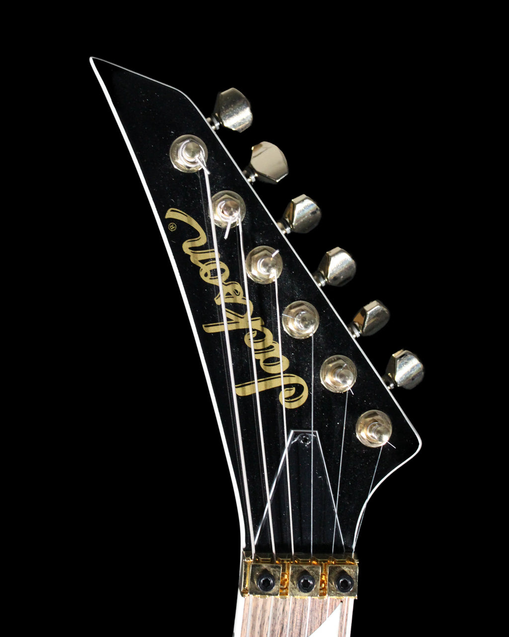 Jackson RRX24 Rhoads electric guitar by CDS Guitars with black finish and sharp V-shaped body, shown from front view.