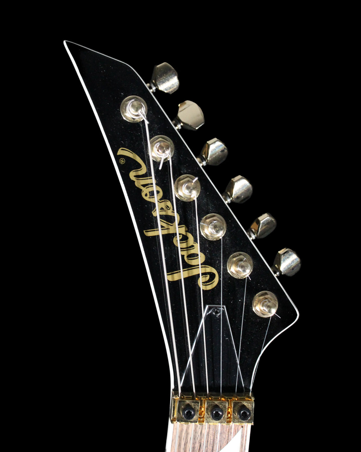 Jackson RRX24 Rhoads electric guitar by CDS Guitars with black finish and sharp V-shaped body, shown from front view.