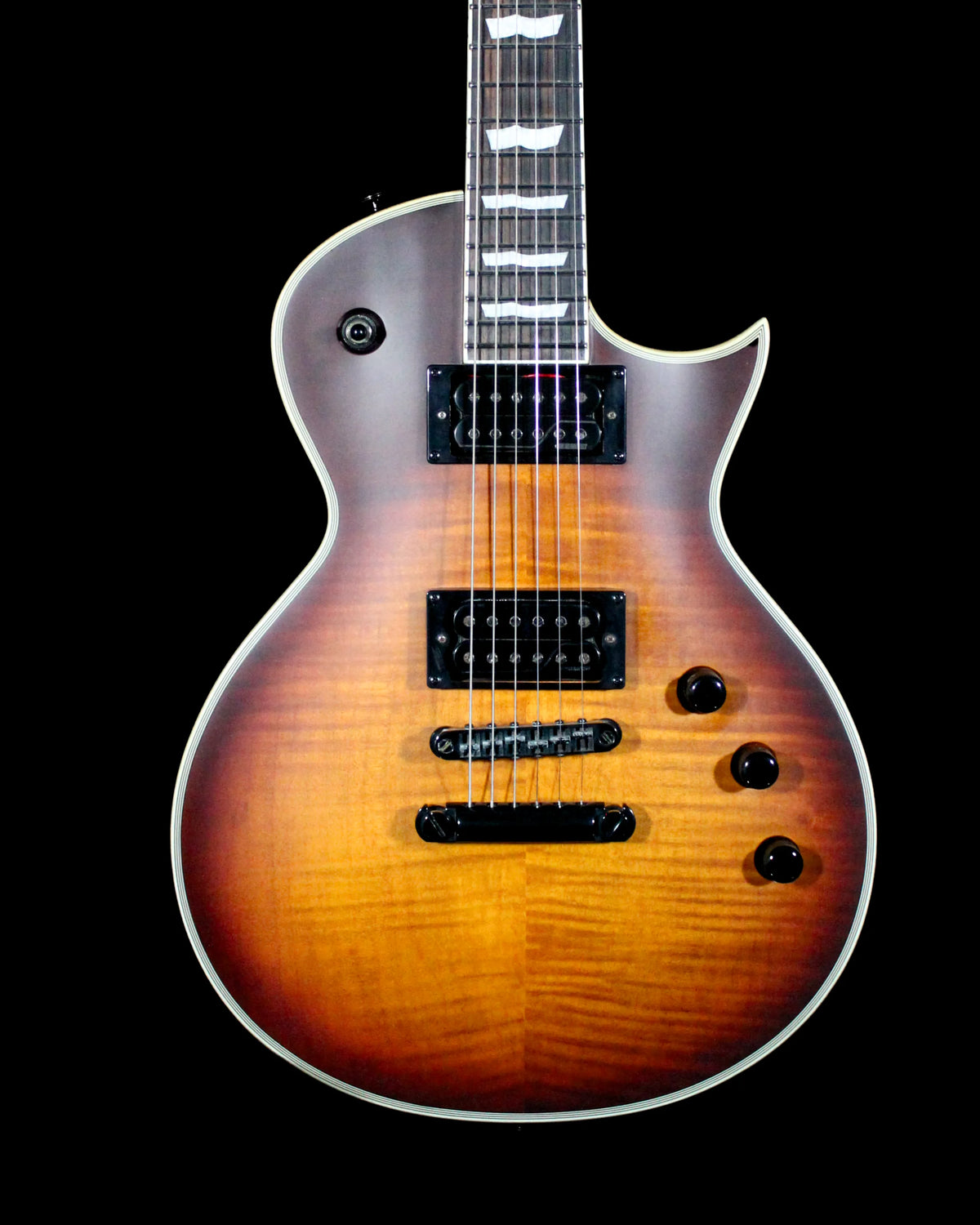 CDS Guitars ESP LTD EC-1000T electric guitar with sleek black finish and chrome hardware, shown resting on a stand.
