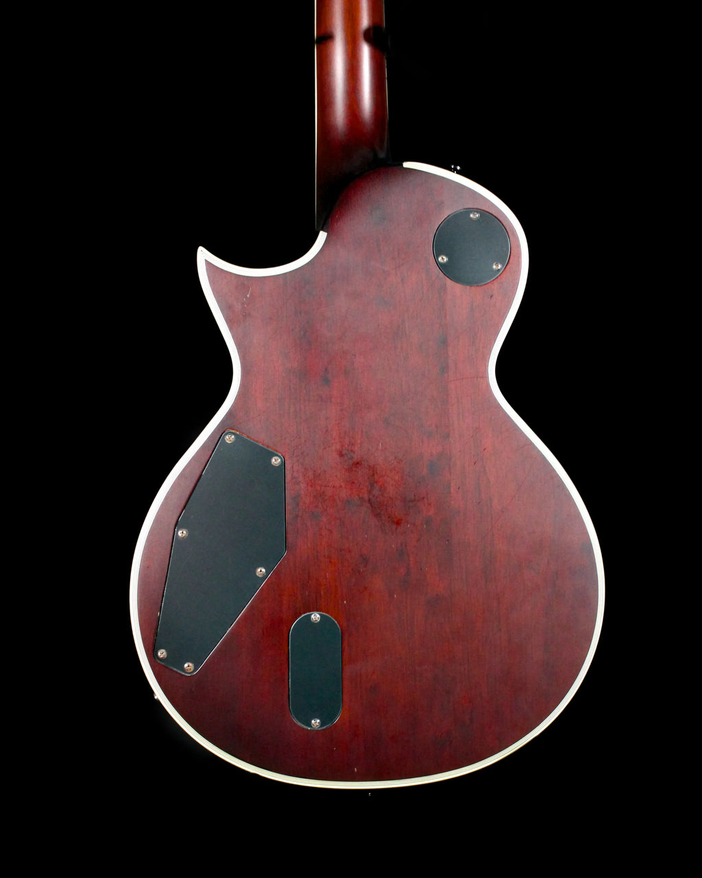 CDS Guitars ESP LTD EC-1000T electric guitar with sleek black finish and chrome hardware, shown on a stand.