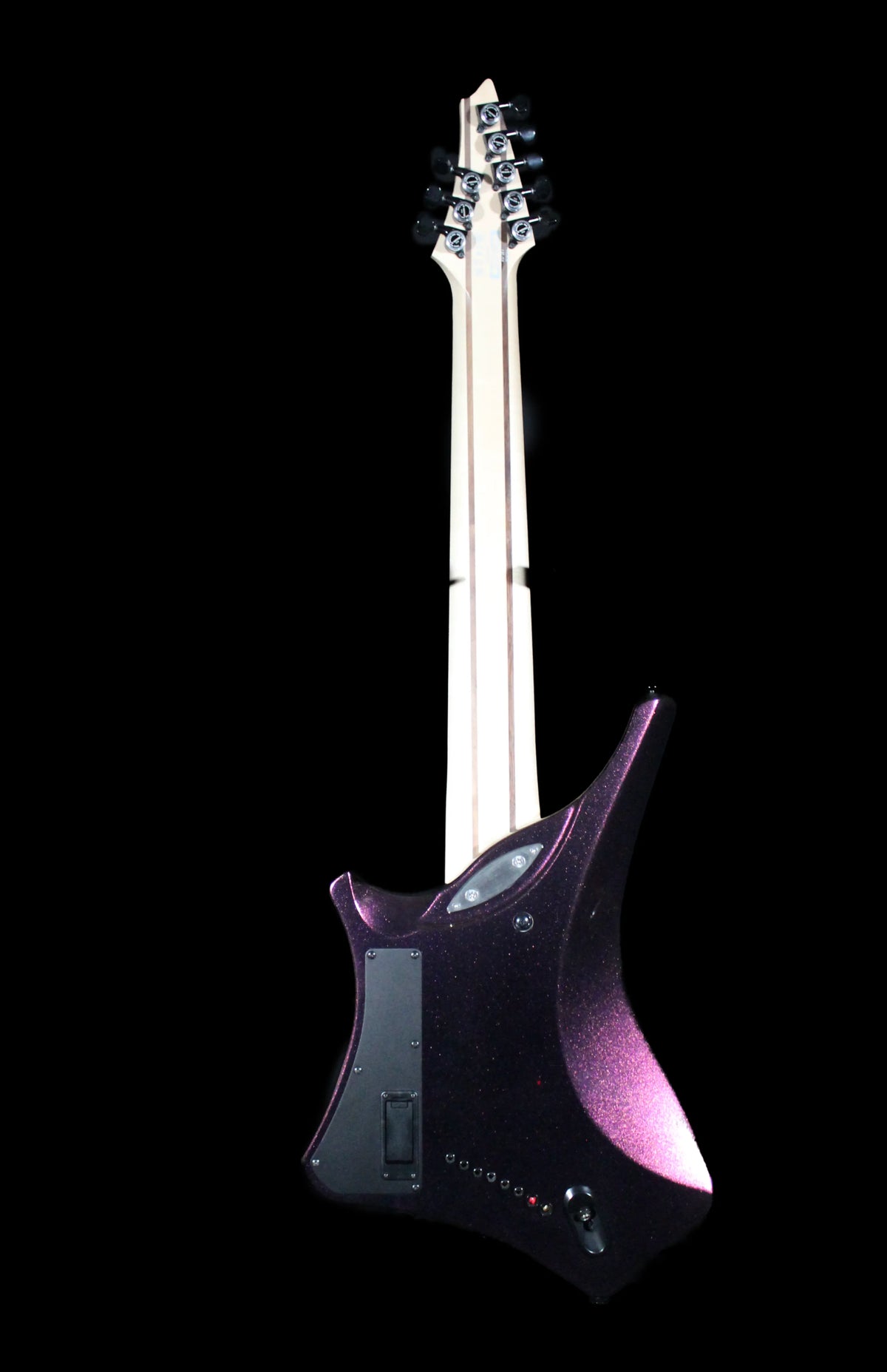 Ibanez Alpha A528-CMG 8-string electric guitar with dark finish and sleek body, shown from a side angle.