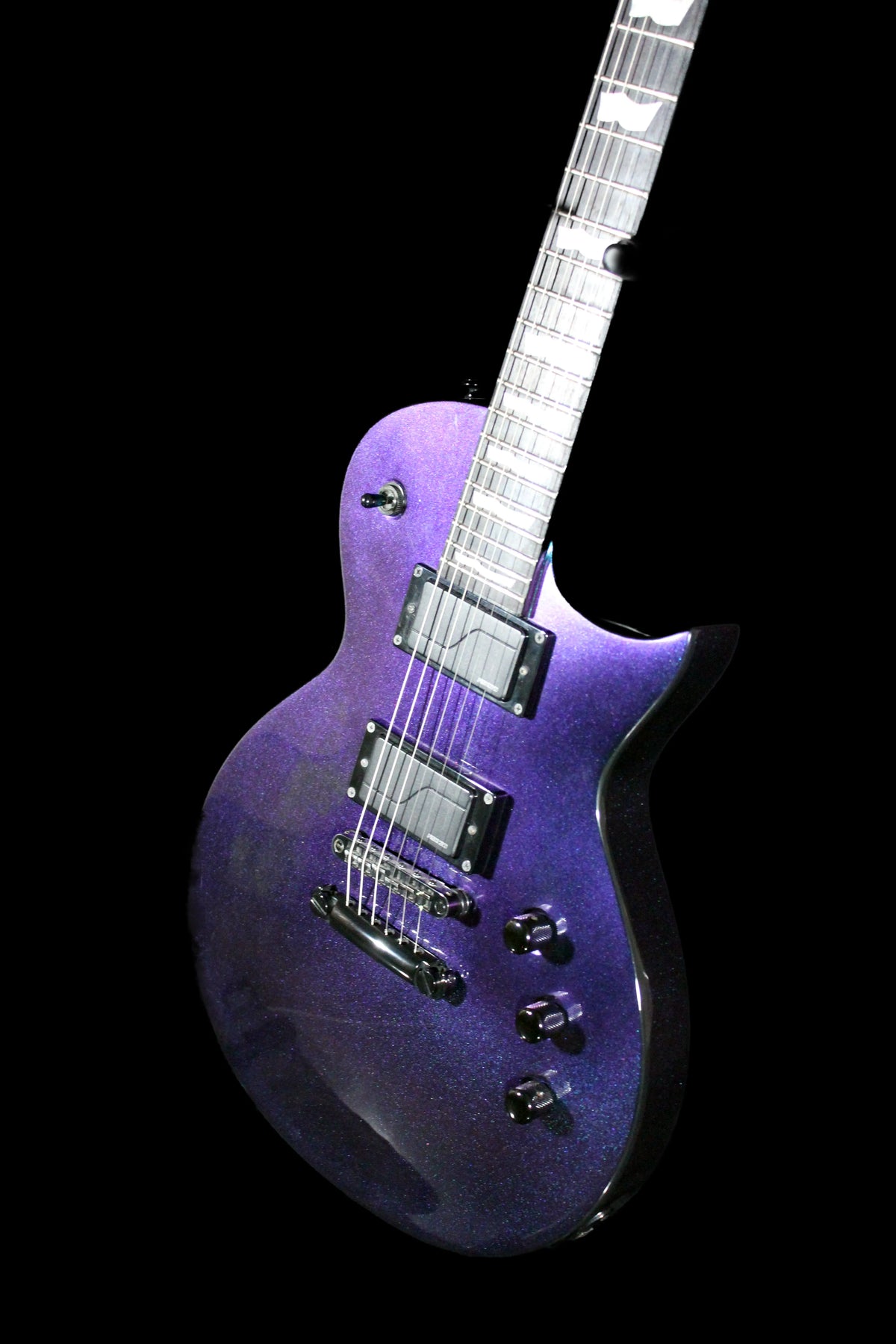 CDS Guitars ESP LTD EC-1000 electric guitar with sleek black finish and chrome hardware, shown resting on a stand.