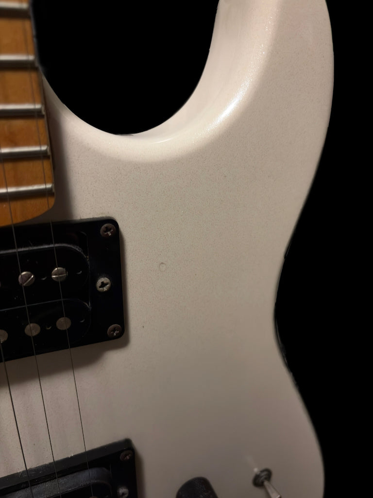 Kramer Pacer Classic Series electric guitar with a sunburst finish and maple neck, displayed on a stand against a neutral background.